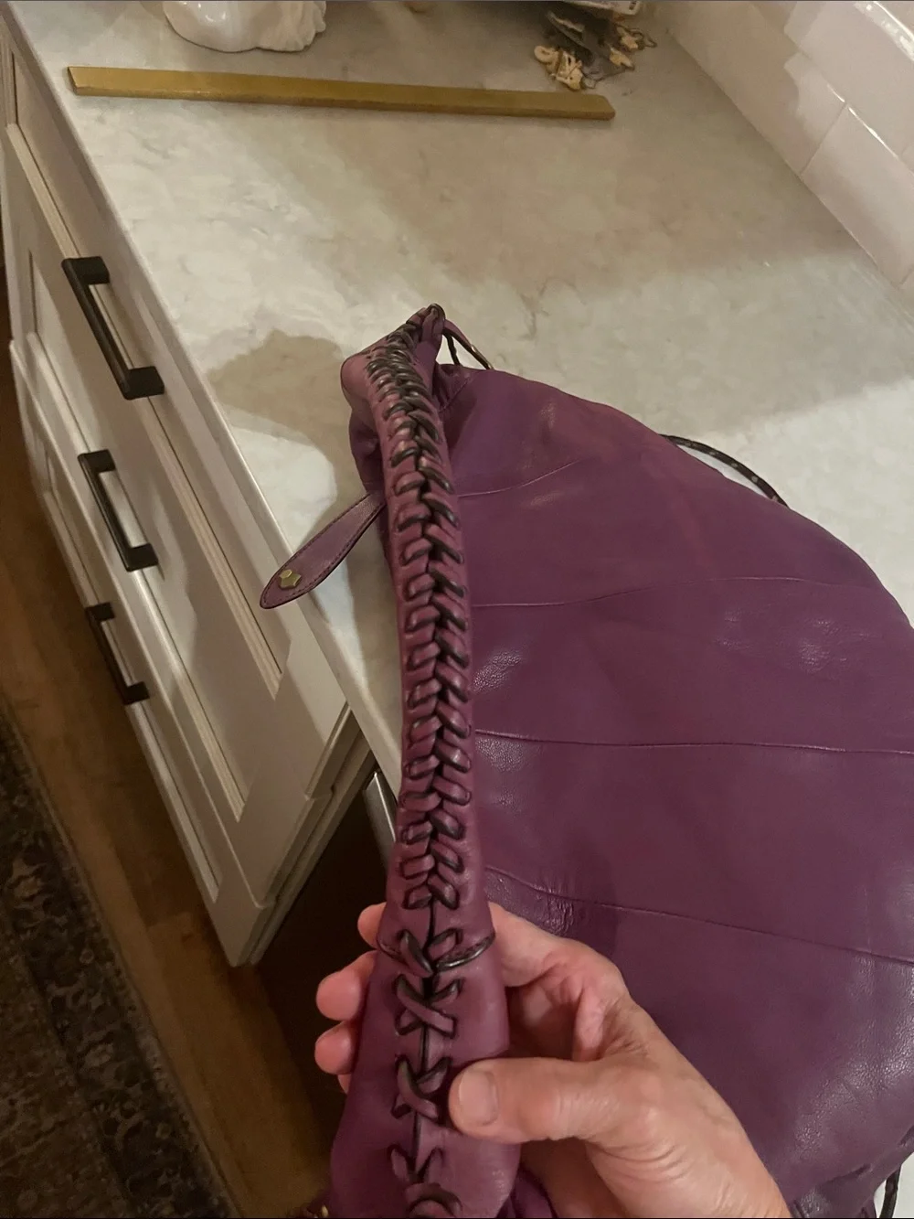 orYANY purple Studded  fringed Leather Hobo Bag with geometric interior material
